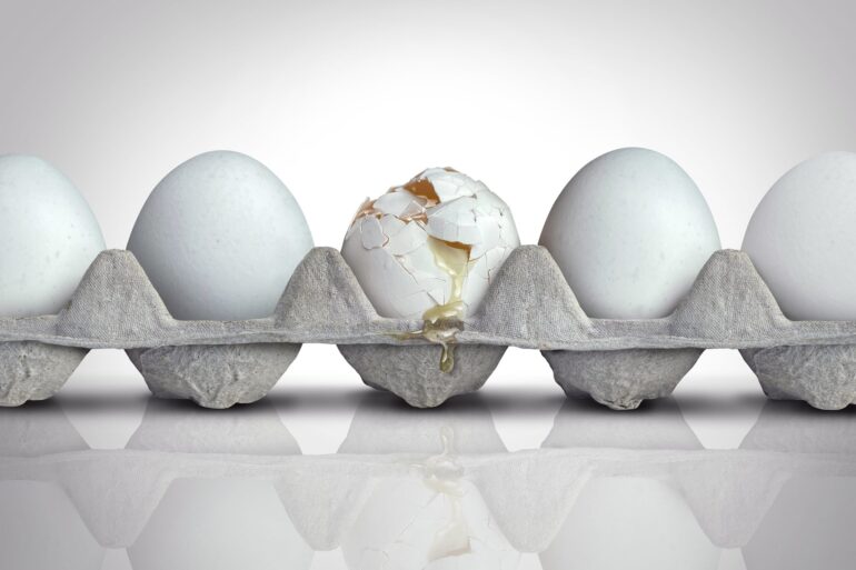Cracked egg in carton scaled.jpg
