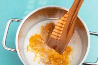 Turmeric latte mixed in pot